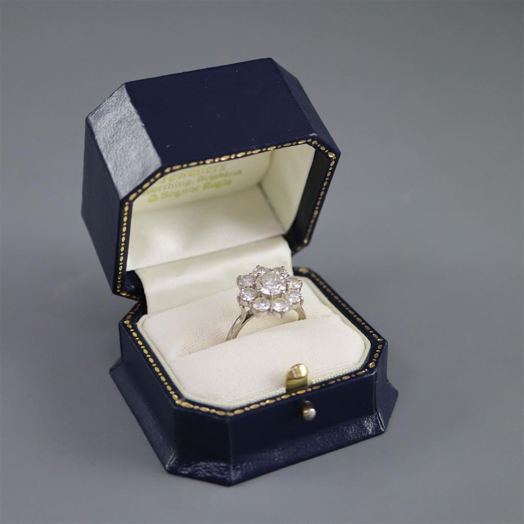 A 1970s 18ct white gold and nine stone diamond cluster ring,